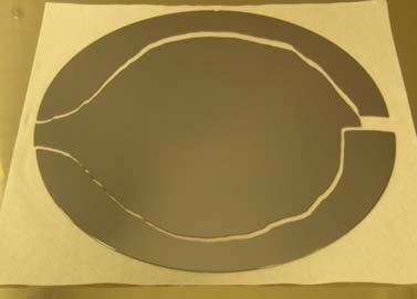 Fig 1. Catastrophic fracture of a 200mm diameter silicon wafer