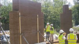 Rammed earth walls under construction