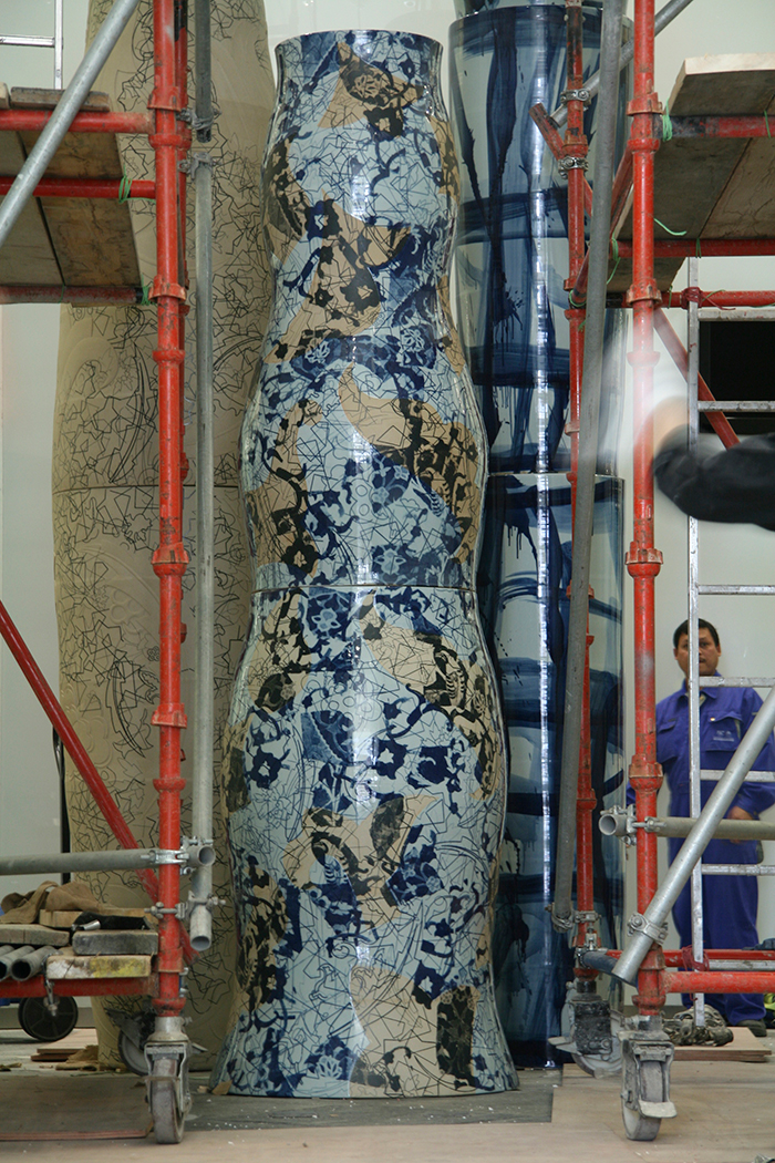 Aylieff Painting Fencai in the Studio (left); Aylieff’s Jingdezhen Tornado Tower Installation, Qatar (right).