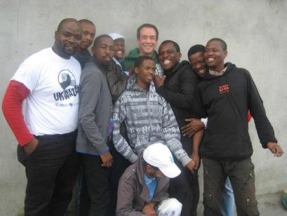 Plate 1. Tucker with Ukwazana Volunteer outreach workers at Shebeen event